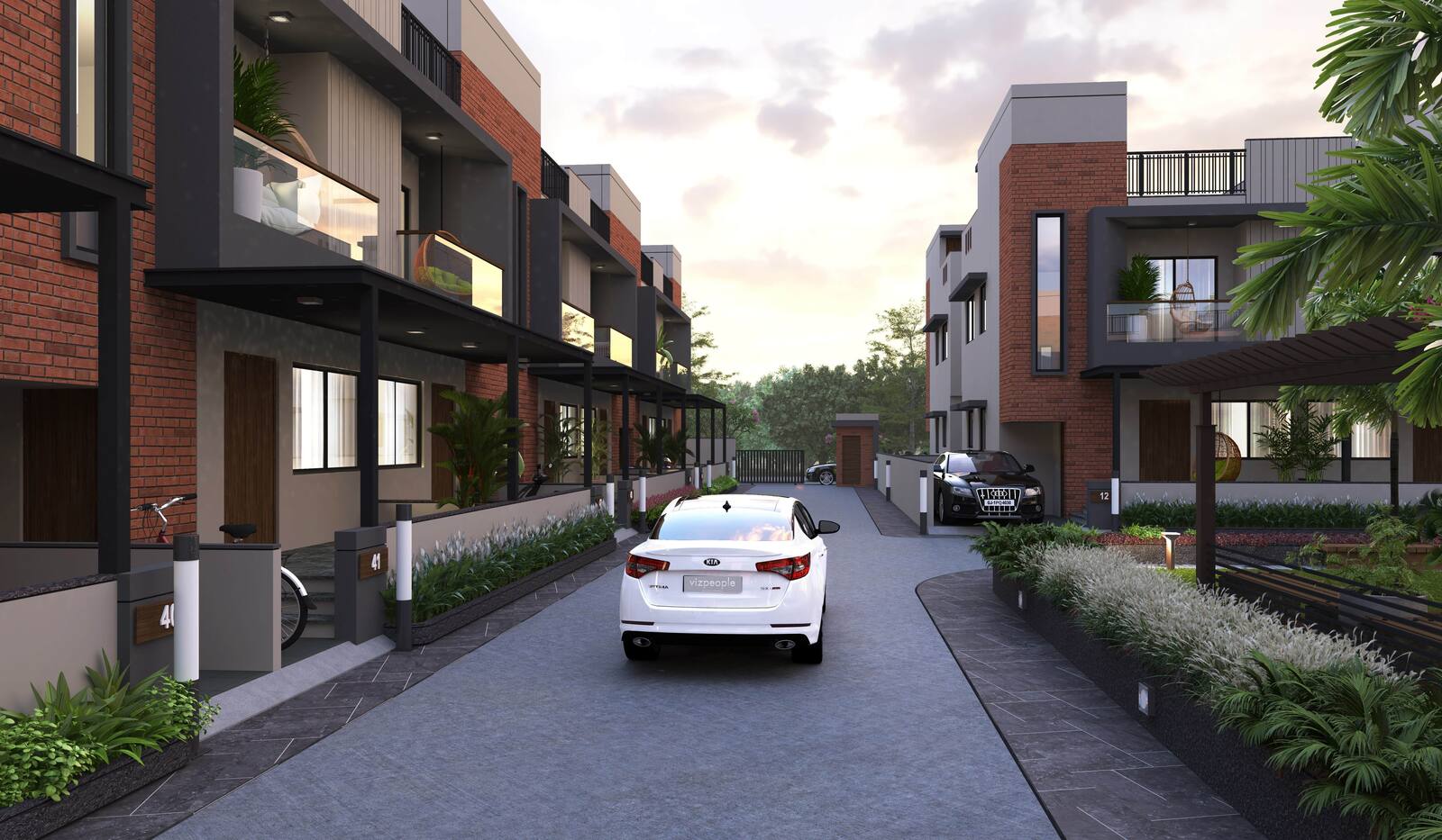 A street through the scheme in the evening with a car on the road