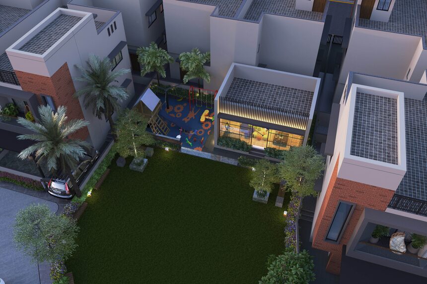 An aerial view of one cluster of bungalows around a pool and garden
