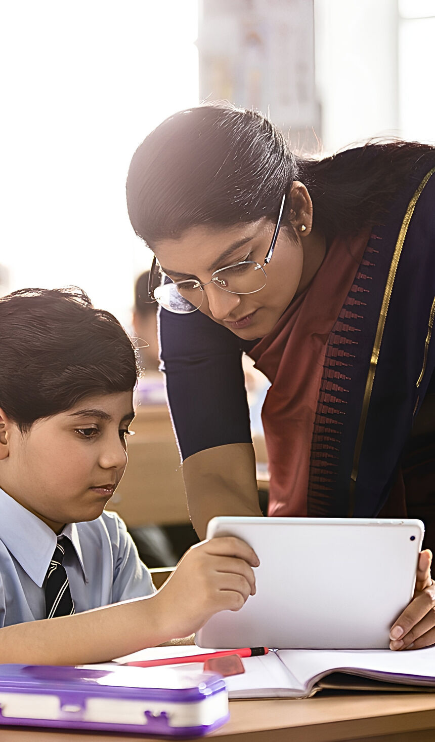 A teacher working with a pupil